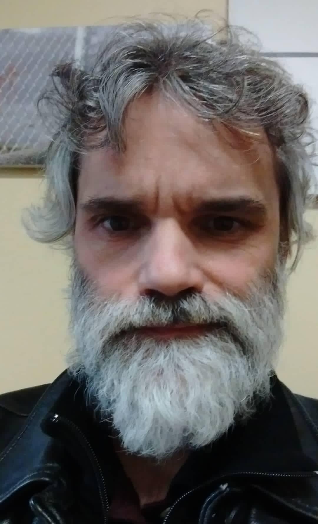 Patrick Fox, needing a haircut and shave after being released from prison